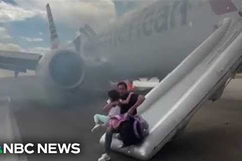 Video shows passengers evacuating American Airlines plane